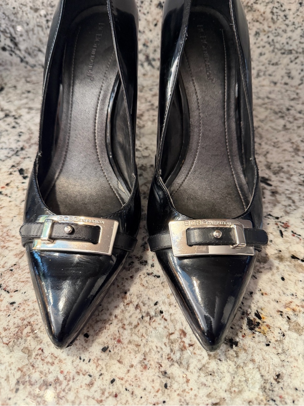 BCBG Black Patent Pointed-Toe Pumps with Silver Buckle Accents